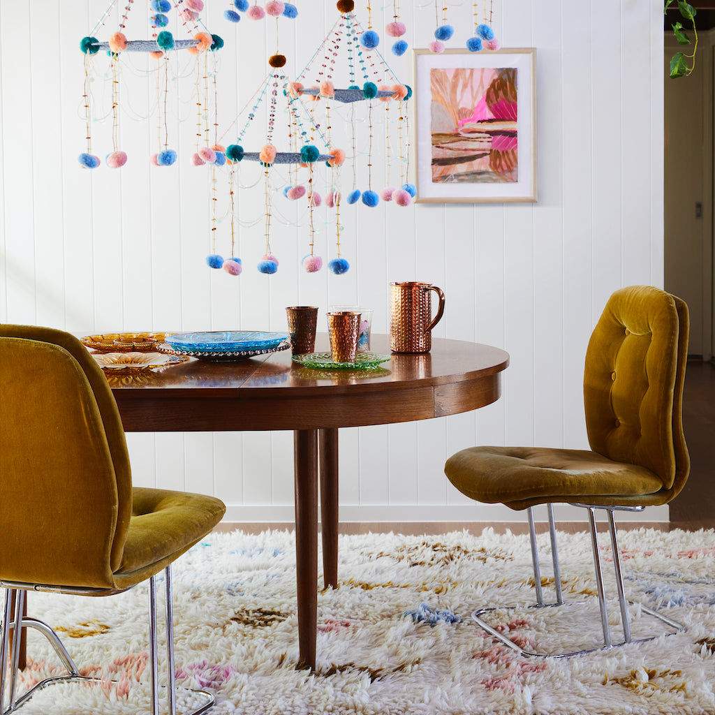 Juno Beni rug with multi-coloured large aztec inspired motifs on float style parchment woven rug. Finished with generous fringed edging.