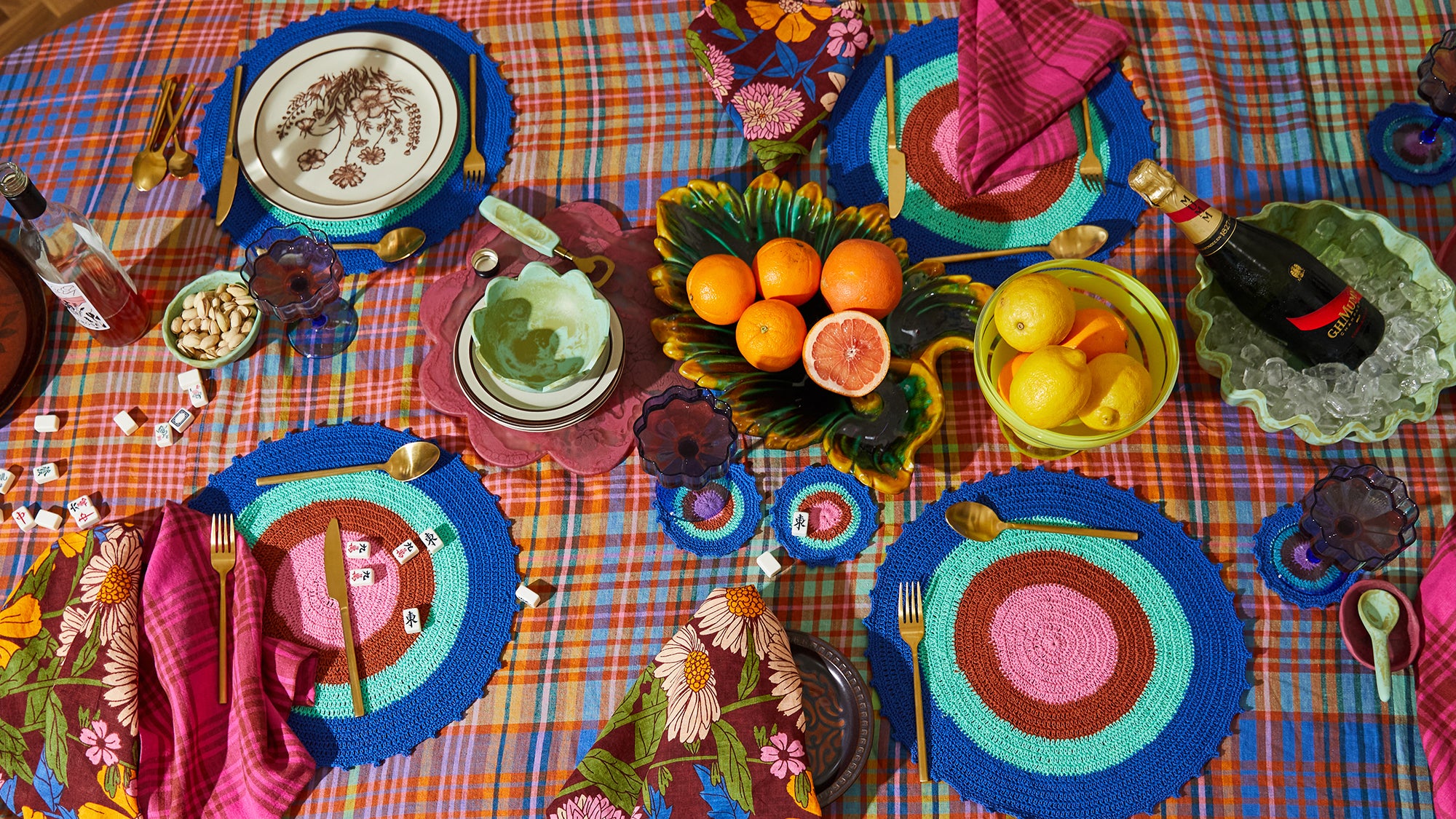 A table laden with colourful napkins, table cloth and beautiful food