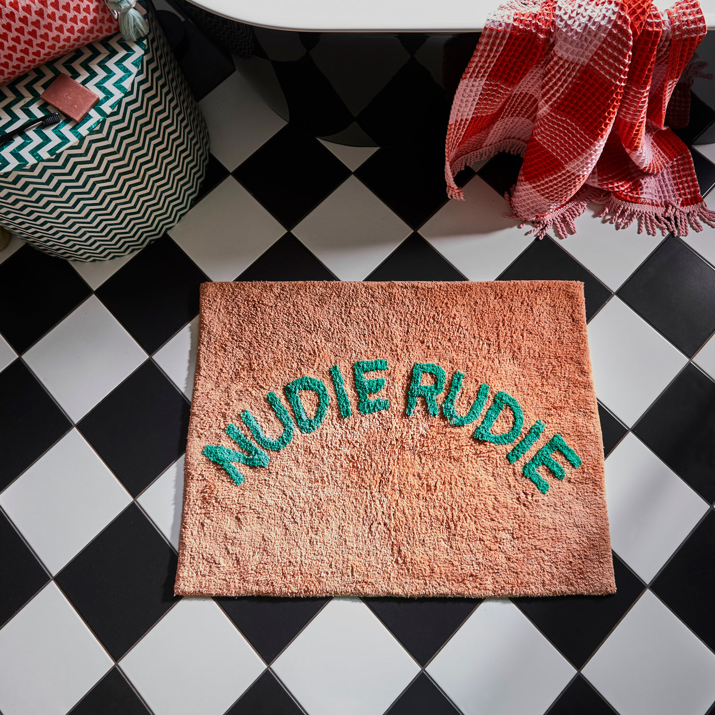 Tula hand tufted nudie rudie bath mat in peach and apple green